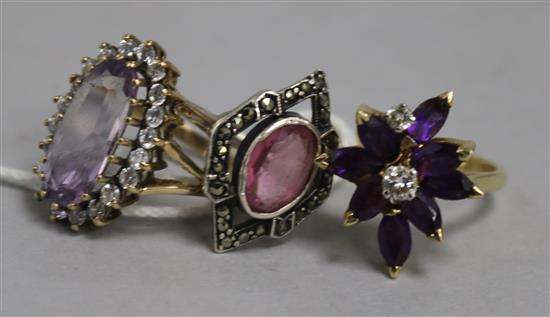 Two amethyst and diamond rings and a marcasite ring